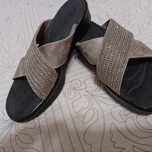 Pair of slip on sketches sandals